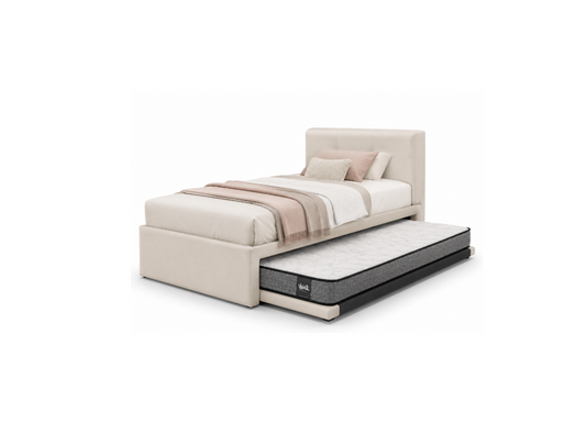 A modern single bed with an upholstered cream headboard and footboard, shown with a mattress pulled out into a trundle. The bed is styled with neutral beige and white bedding, set against a plain white background.