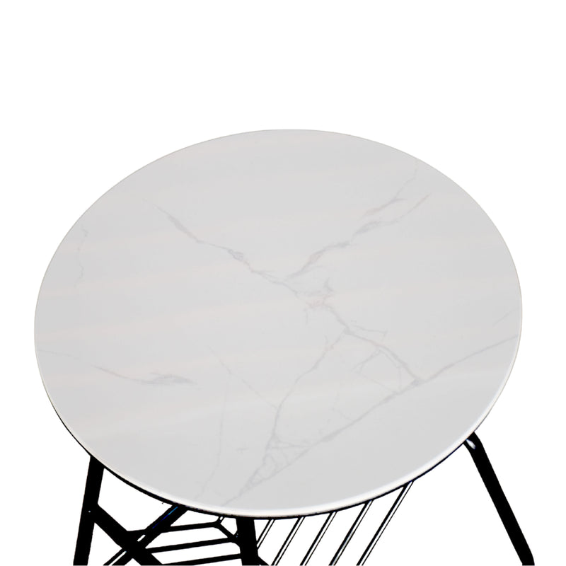 Round white cushion on a black metal stool against a white background