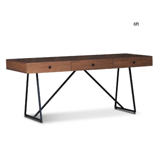 Long wooden desk with black metal legs on a white background