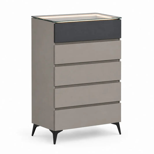 A modern 5-drawer dresser with a taupe-gray finish, a contrasting dark charcoal drawer on top, a clear glass top, and black tapered legs, shown on a white background.