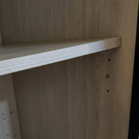 Wooden shelf with a plain background
