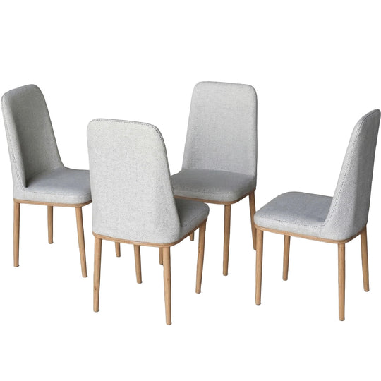 Four gray upholstered chairs with wooden legs on a white background