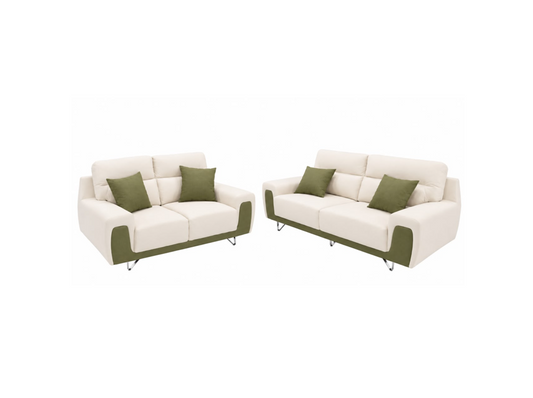 A matching two-piece sofa set consisting of a loveseat and a three-seater couch, upholstered in off-white fabric with sage green accent panels on the lower front and on the sides of the seat and back, accented with two sage green throw pillows on each sofa. The set is photographed against a seamless white background.