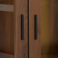 Wooden cabinet with black handles on a blurred background