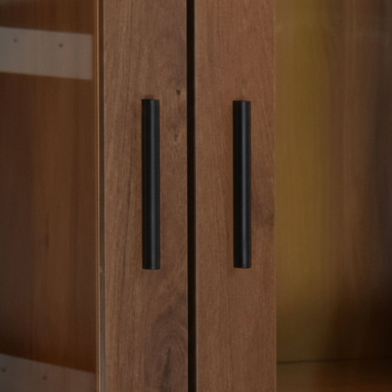 Wooden cabinet with black handles on a blurred background