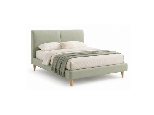 A light sage green upholstered bed frame with a tall rectangular headboard and matching footboard, shown with cream bedding, two pillows, and a matching sage green throw blanket on a white background.