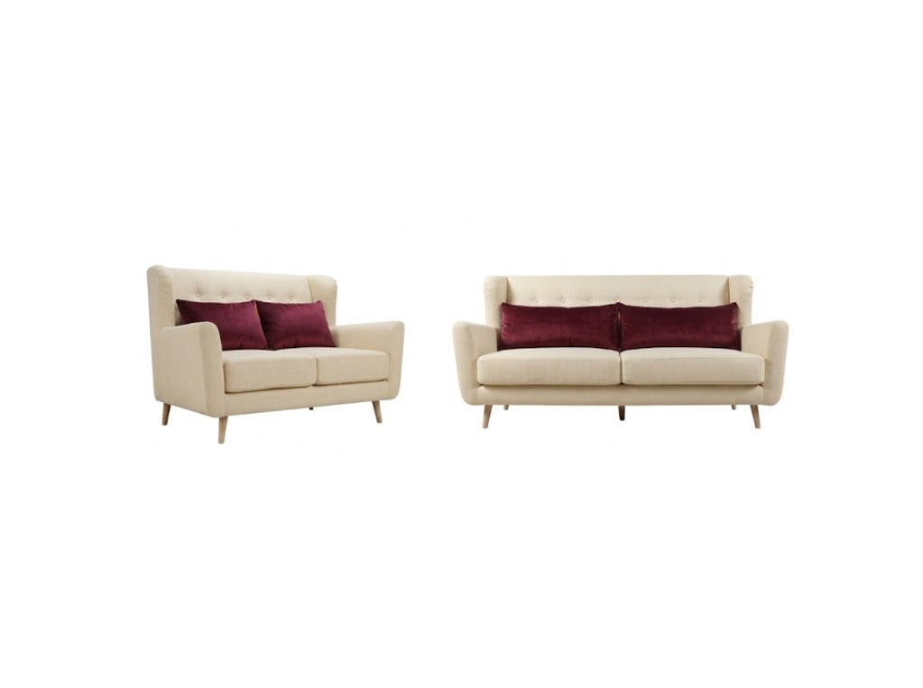 A matching set of a cream-colored loveseat and a matching armchair, each styled with two deep burgundy accent pillows, set against a plain white background.