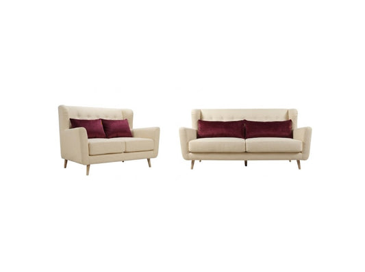 A matching set of a cream-colored loveseat and a matching armchair, each styled with two deep burgundy accent pillows, set against a plain white background.