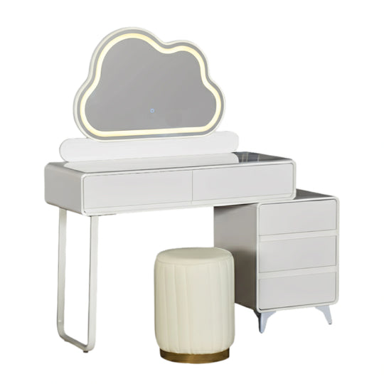 White vanity table with cloud-shaped mirror and stool on a white background