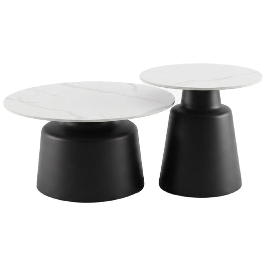 Two modern coffee tables with white marble tops and black cylindrical bases on a white background