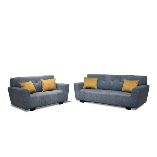 Two blue sofas with yellow cushions on a white background