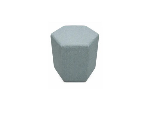 A hexagonal upholstered ottoman stool in a textured light blue-gray fabric, shown from a direct top-down view on a solid white background.