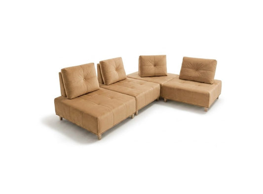 A modular L-shaped sectional sofa upholstered in tan bouclé fabric, featuring tufted back cushions and a chaise lounge section