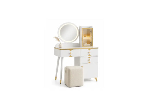 White vanity table set with gold accents, featuring a round illuminated mirror, three drawers with gold handles, a side cabinet with warm lighting, and a matching beige ottoman on a white background.
