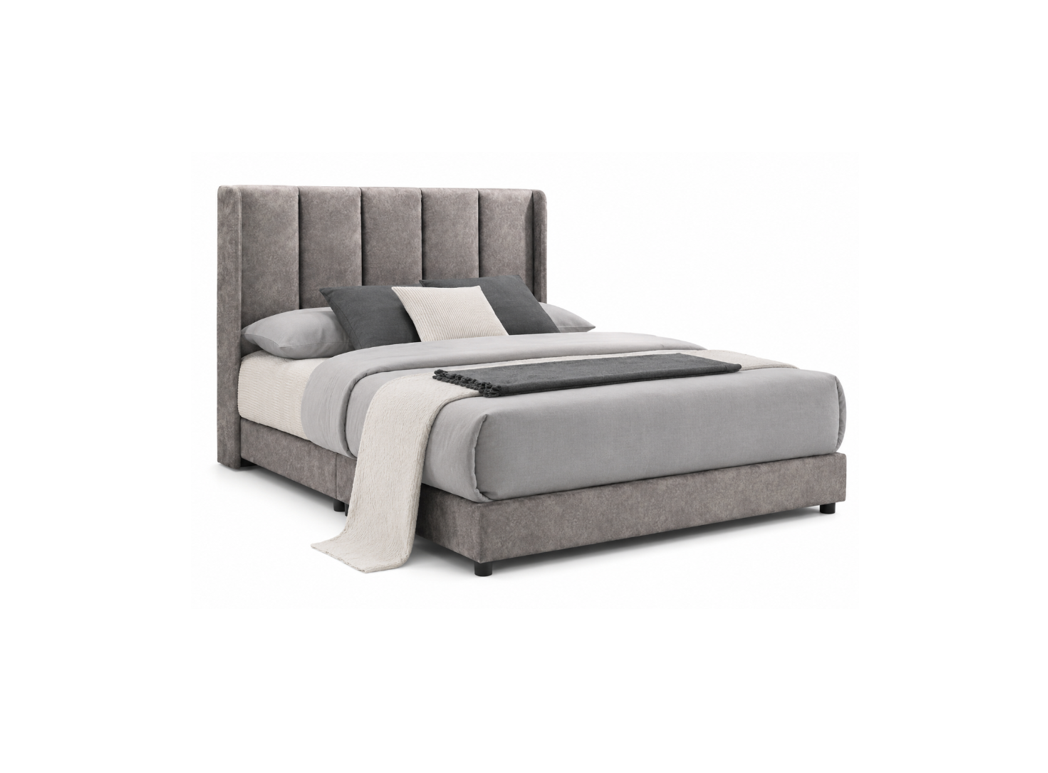 A modern platform bed with a tall, vertically channel-tufted upholstered headboard and matching upholstered footboard in a textured gray fabric. The bed is styled with gray and white bedding, pillows, and a light gray throw blanket, set against a plain white background.