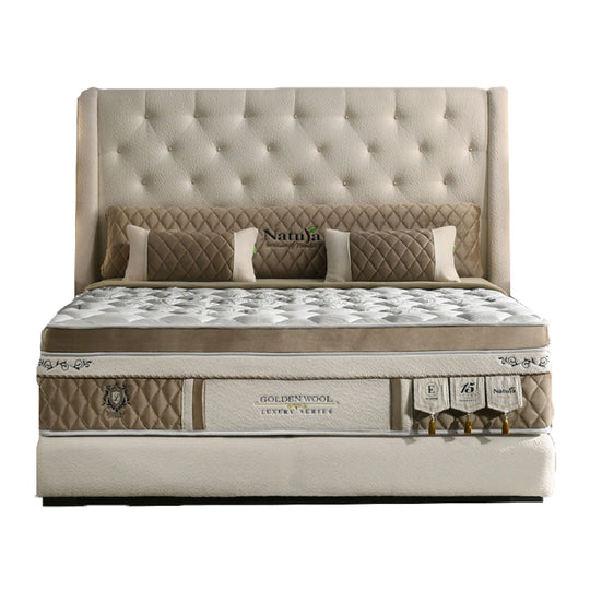 Beige and brown mattress with tufted headboard on a white background