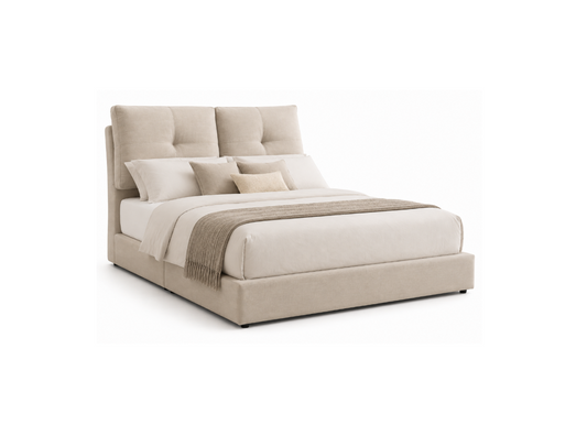 A modern platform bed with a tall, tufted upholstered headboard and matching upholstered footboard, dressed in white bedding with a beige throw blanket and decorative pillows, set against a plain white background.