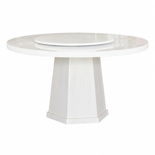 A modern round dining table with a glossy white marble-look top and a geometric pedestal base, shown on a plain white background.