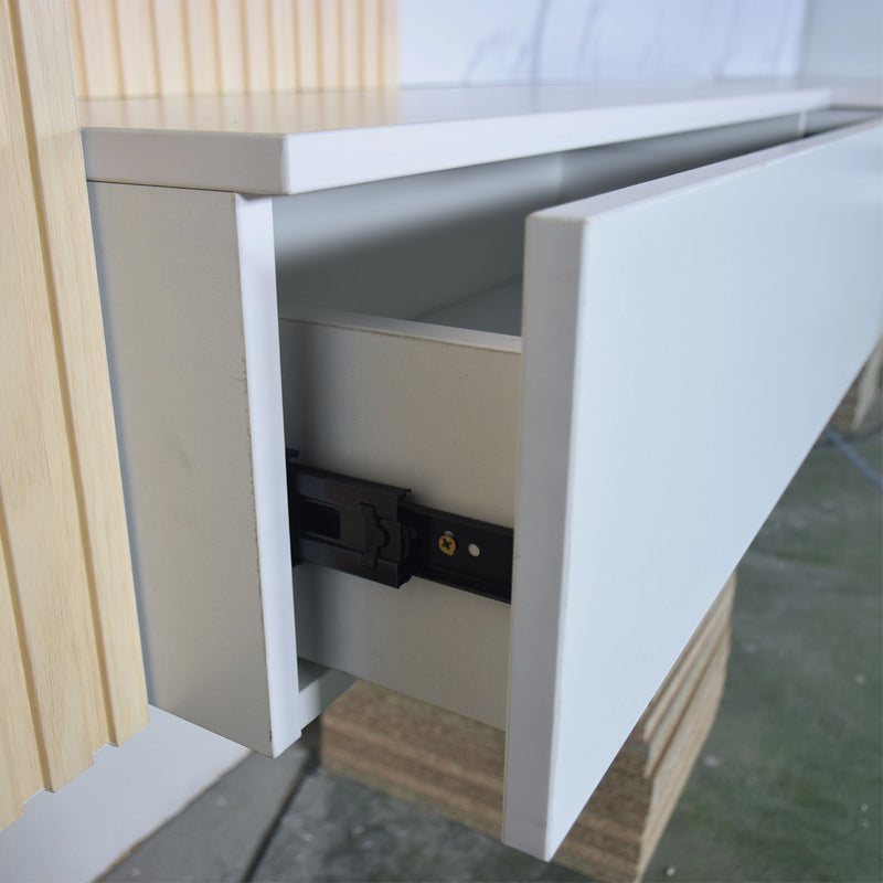 Open cabinet drawer with visible hardware on a wooden surface
