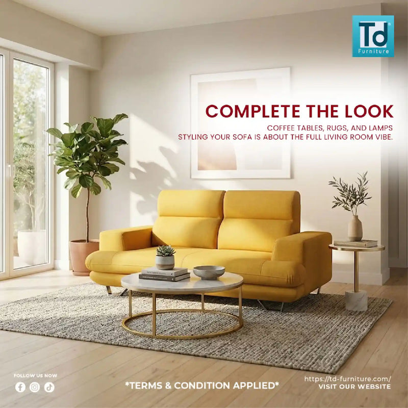 Yellow sofa in a modern living room with decor elements and TD Furniture logo.