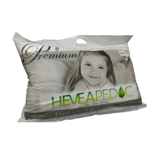 Packaged pillow with a child's face on the label, featuring the brand 'HEVEA PEDOC'.