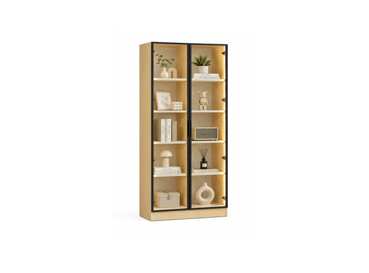 A tall light wood bookcase with two black-framed glass doors and six open shelves, styled with books, vases, and small decor items, shown on a plain white background.