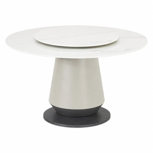 A modern round dining table featuring a white marble-patterned top with a concentric inner plate, supported by a tapered off-white pedestal base with a dark gray circular foot ring, shown on a plain white background.