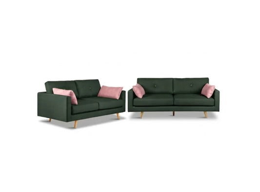 A matching two-piece sofa set consisting of a two-seater loveseat and a three-seater sofa, both upholstered in dark forest green fabric with light wood legs and accented by pink throw pillows, shown against a plain white background.