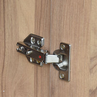 Metal cabinet hinge on a wooden door