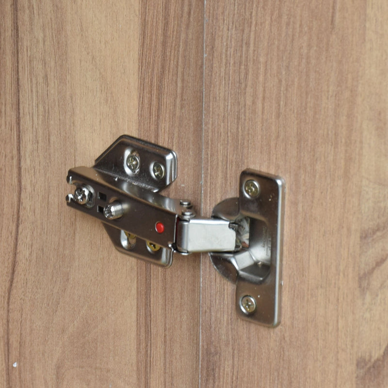 Metal cabinet hinge on a wooden door