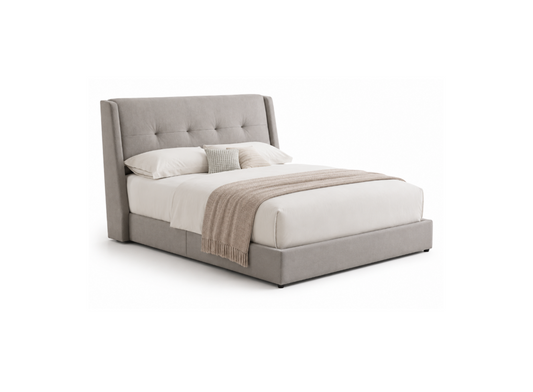 A modern platform bed with a tall, tufted wingback headboard and matching upholstered base, shown in a light gray fabric. The bed is styled with white bedding, two accent pillows, and a beige throw blanket, set against a plain white background.