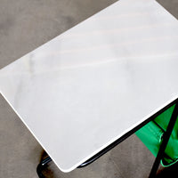 White rectangular object on a gray surface