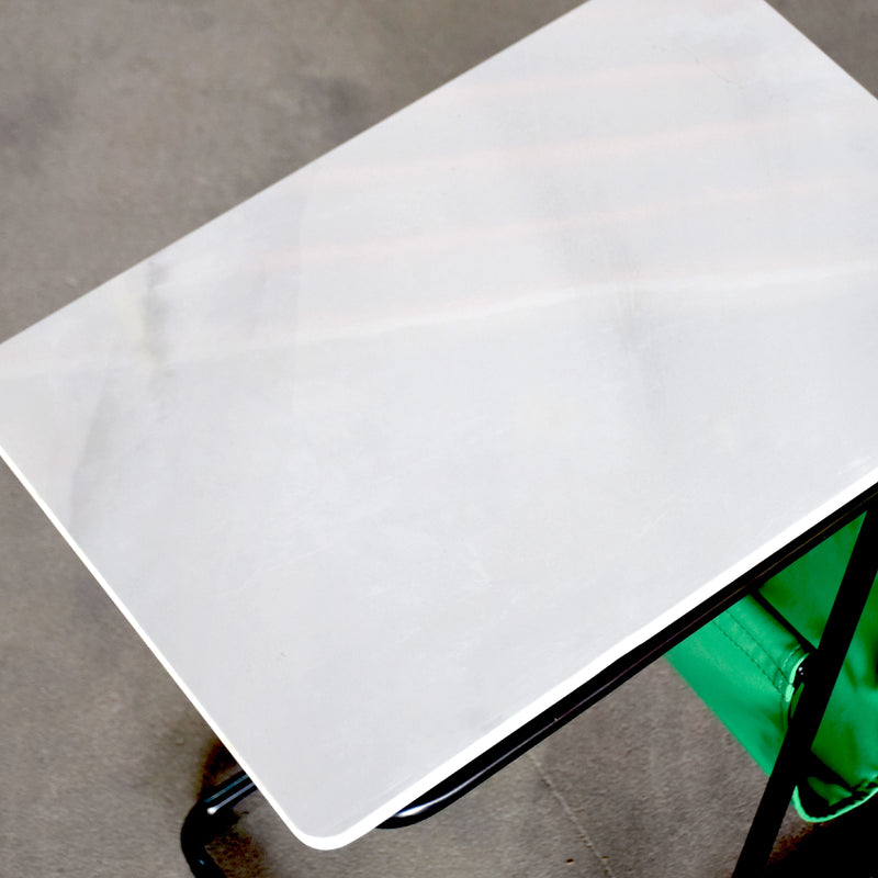 White rectangular object on a gray surface