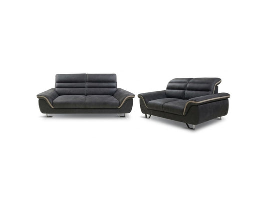 A two-piece modern sofa set consisting of a two-seater sofa and a matching single armchair, upholstered in dark charcoal gray leather with subtle gold-toned piping along the armrests, shown on a plain white background.