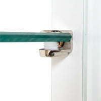 Close-up of a shower door roller with a green track on a white background