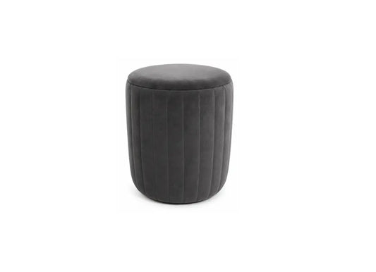 A dark gray cylindrical ottoman with vertical channel tufting, shown on a plain white background.