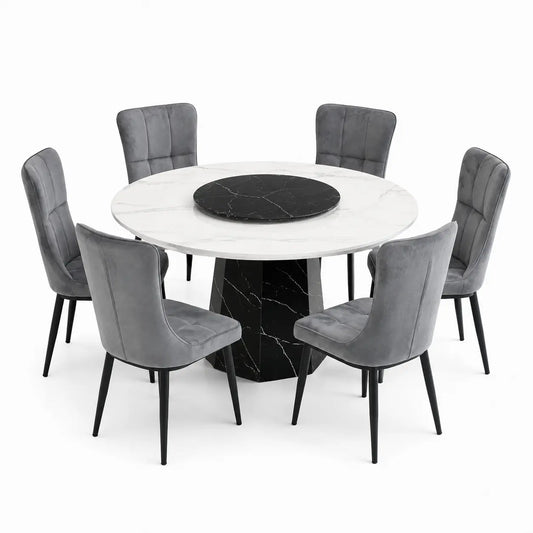 A modern round dining table set with a white marble tabletop, a black marble center insert, and six gray velvet upholstered chairs with black legs, shown on a white background.