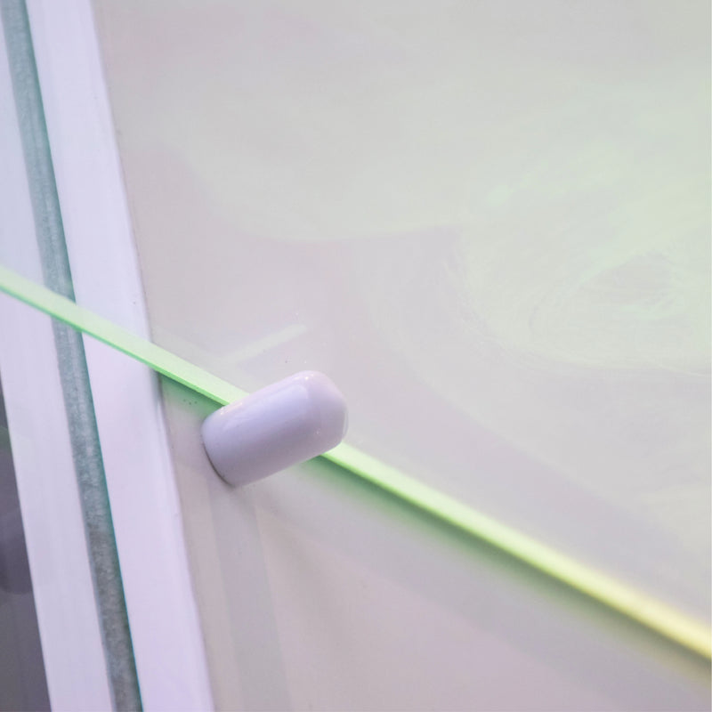 Close-up of a white cylindrical object on a green and gray background