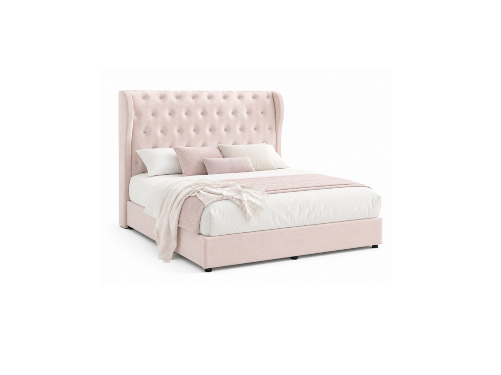 A light blush pink upholstered bed with a tall, button-tufted wingback headboard, styled with white bedding, pink accent pillows, and a matching pink throw blanket, set against a plain white background.