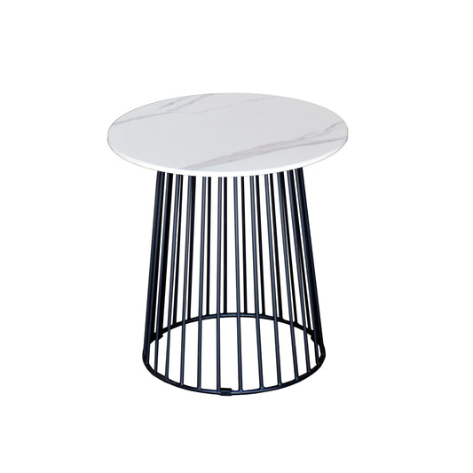 Small round table with a white marble top and black metal base on a white background