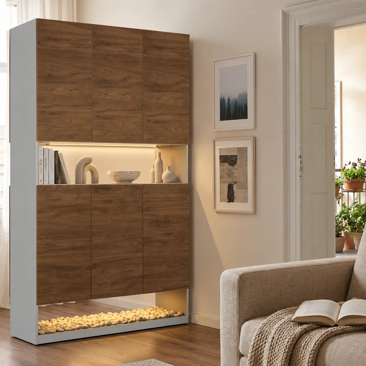 A tall modern storage cabinet with a wood grain finish and integrated shelving, shown in a styled living room next to a sofa.