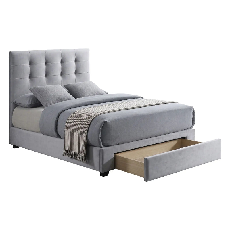 Gray upholstered bed with tufted headboard and open drawer on a white background