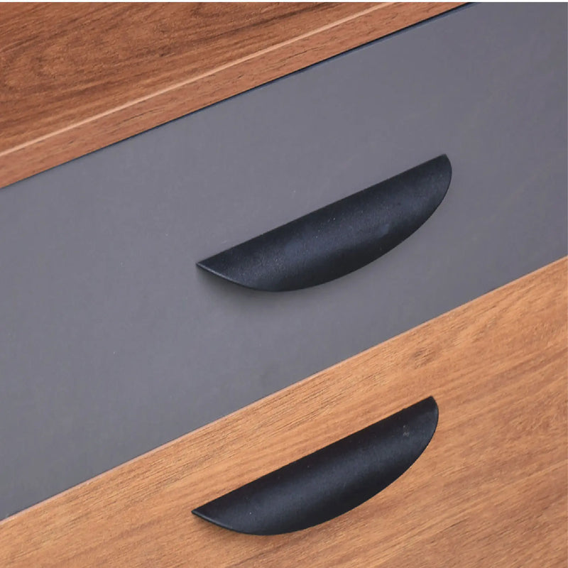 Black curved handles on a wooden and gray surface