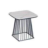 Side table with marble top and black metal frame on a white background