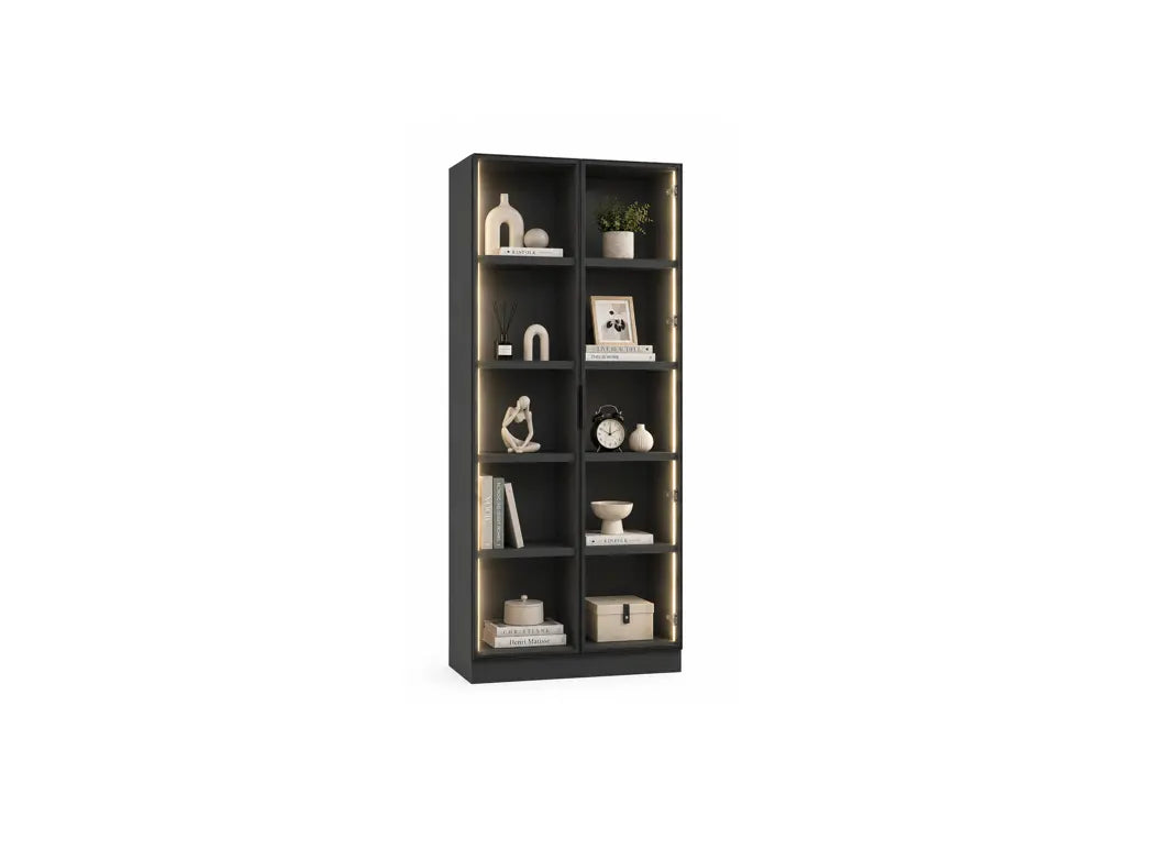 A tall, narrow black bookcase with multiple shelves, styled with home decor items, shown against a plain white background.
