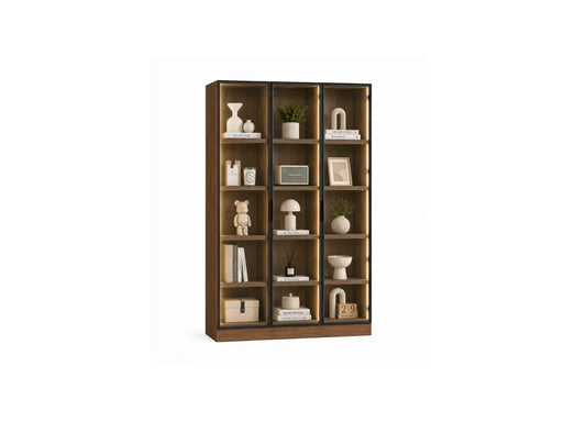 A tall wooden bookcase with multiple open shelves, styled with neutral-toned decor including vases, books, a small plant, a lamp, and framed art, shown against a plain white background.