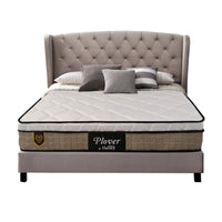 Bed with tufted headboard and Plover mattress on a white background