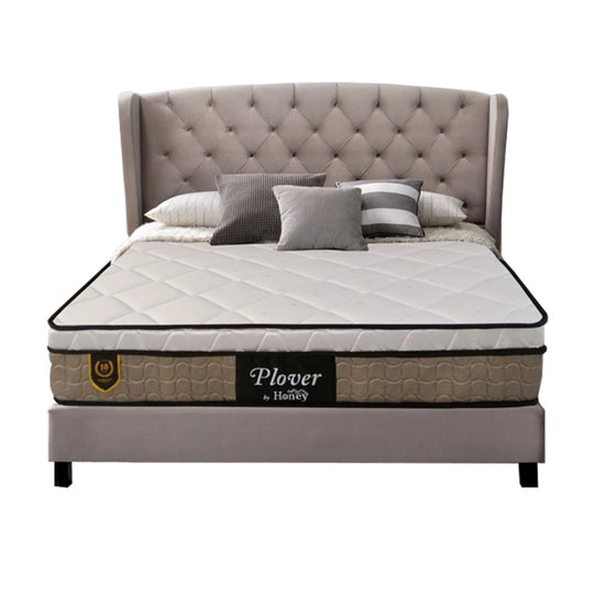 Bed with tufted headboard and Plover mattress on a white background