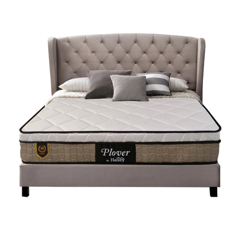 Bed with tufted headboard and Plover mattress on a white background