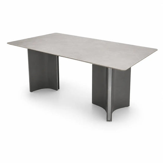 A modern rectangular conference table with a light gray stone or concrete-look top and dark gray curved metal pedestal legs, shown on a white background.